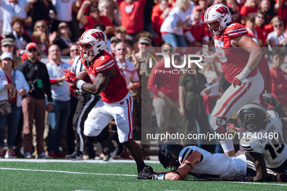 Wisconsin Badgers running back Tawee Walker #3 escapes the Purdue Boilermakers defense for a touchdown at Camp Randall Stadium in Madison, W...