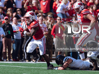 Wisconsin Badgers running back Tawee Walker #3 escapes the Purdue Boilermakers defense for a touchdown at Camp Randall Stadium in Madison, W...