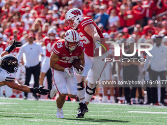 Wisconsin Badgers running back Cade Yacamelli #25 runs in a touchdown against the Purdue Boilermakers at Camp Randall Stadium in Madison, Wi...