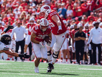 Wisconsin Badgers running back Cade Yacamelli #25 runs in a touchdown against the Purdue Boilermakers at Camp Randall Stadium in Madison, Wi...