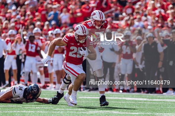 Wisconsin Badgers running back Cade Yacamelli #25 runs in a touchdown against the Purdue Boilermakers at Camp Randall Stadium in Madison, Wi...