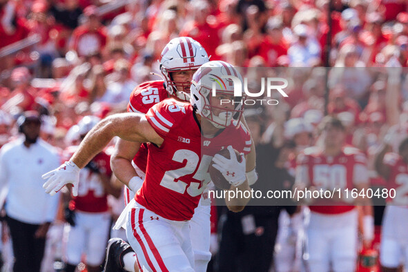 Wisconsin Badgers running back Cade Yacamelli #25 runs in a touchdown against the Purdue Boilermakers at Camp Randall Stadium in Madison, Wi...