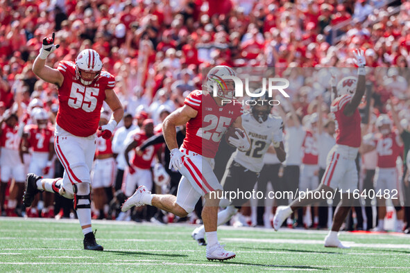 Wisconsin Badgers running back Cade Yacamelli #25 runs in a touchdown against the Purdue Boilermakers at Camp Randall Stadium in Madison, Wi...