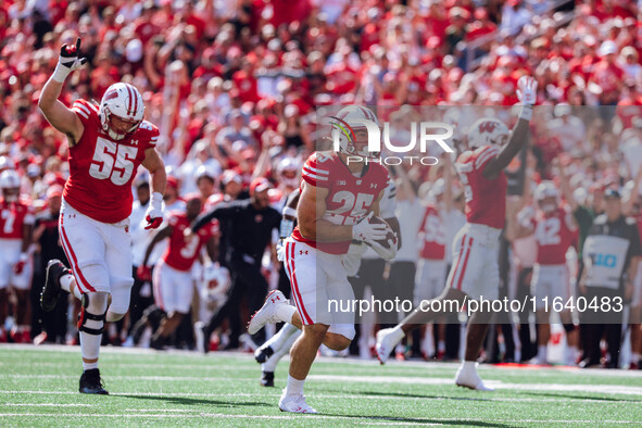 Wisconsin Badgers running back Cade Yacamelli #25 runs in a touchdown against the Purdue Boilermakers at Camp Randall Stadium in Madison, Wi...