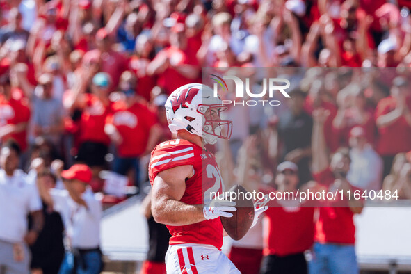 Wisconsin Badgers running back Cade Yacamelli #25 runs in a touchdown against the Purdue Boilermakers at Camp Randall Stadium in Madison, Wi...