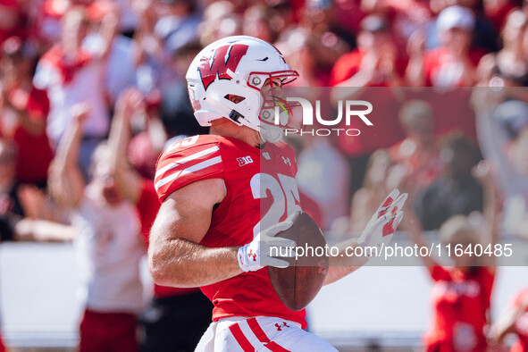 Wisconsin Badgers running back Cade Yacamelli #25 runs in a touchdown against the Purdue Boilermakers at Camp Randall Stadium in Madison, Wi...