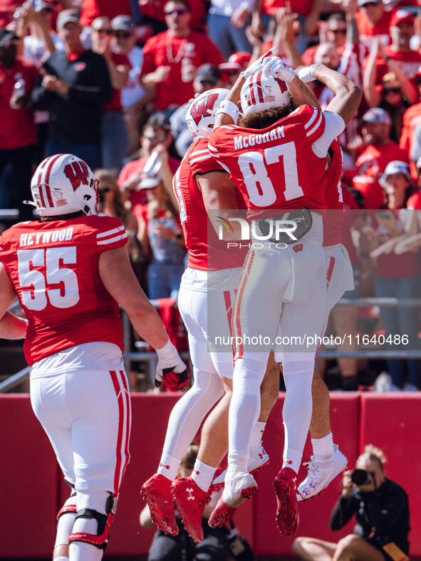 The Wisconsin Badgers celebrate a Cade Yacamelli #25 touchdown against the Purdue Boilermakers at Camp Randall Stadium in Madison, Wisconsin...