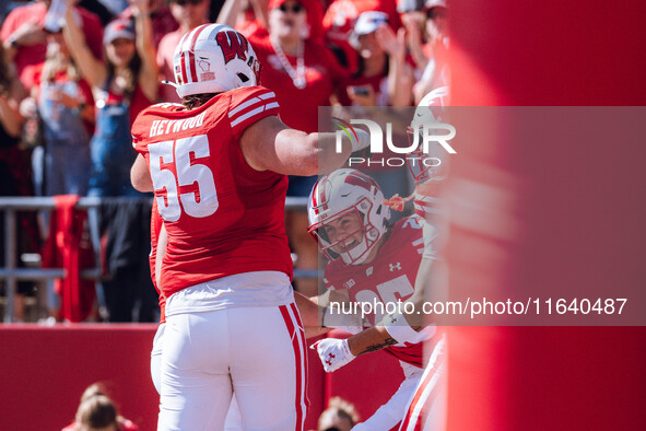 The Wisconsin Badgers celebrate a Cade Yacamelli #25 touchdown against the Purdue Boilermakers at Camp Randall Stadium in Madison, Wisconsin...