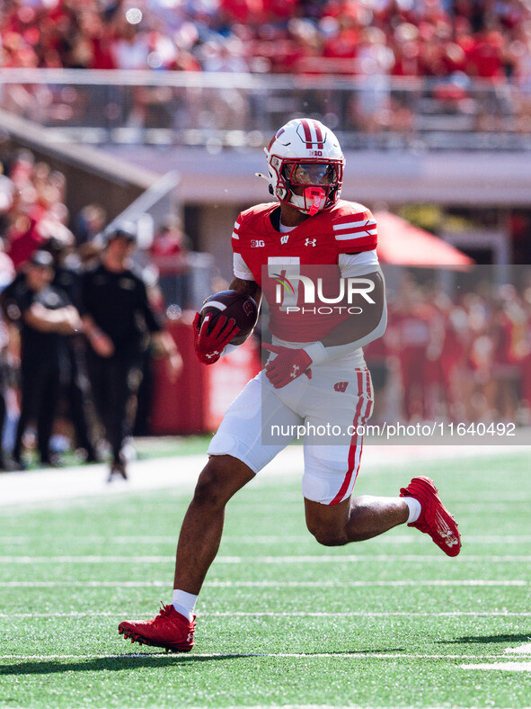 Wisconsin Badgers running back Dilin Jones #7 runs the ball against the Purdue Boilermakers at Camp Randall Stadium in Madison, Wisconsin, o...