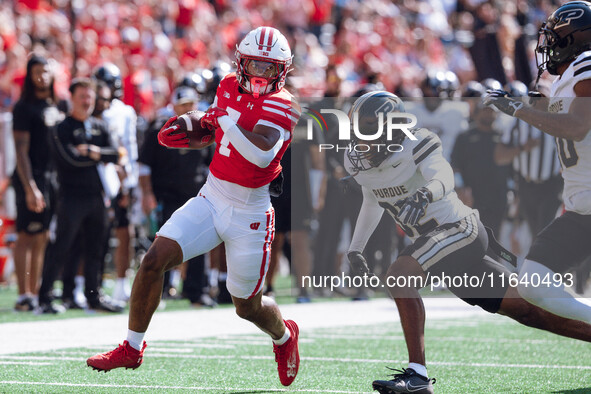 Wisconsin Badgers running back Dilin Jones #7 runs the ball against the Purdue Boilermakers at Camp Randall Stadium in Madison, Wisconsin, o...