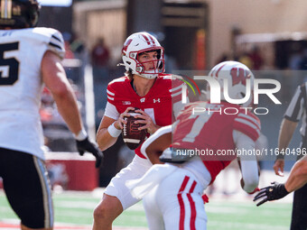 Wisconsin Badgers quarterback Mabrey Mettauer #11 looks to pass against the Purdue Boilermakers at Camp Randall Stadium in Madison, Wisconsi...