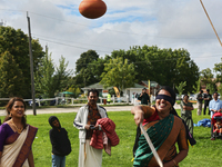 A woman plays the uriyadi game (pot breaking game) during the Onam Festival in Woodbridge, Ontario, Canada, on September 07, 2024. Onam is a...