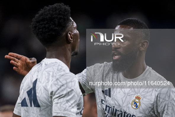 Antonio Rudiger of Real Madrid CF (right) talks with Aurelien Tchouameni of Real Madrid CF (left) during the La Liga EA Sports 2024/25 footb...