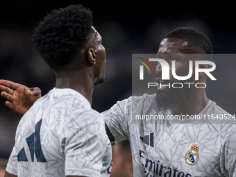 Antonio Rudiger of Real Madrid CF (right) talks with Aurelien Tchouameni of Real Madrid CF (left) during the La Liga EA Sports 2024/25 footb...