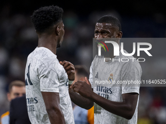 Antonio Rudiger of Real Madrid CF (right) talks with Aurelien Tchouameni of Real Madrid CF (left) during the La Liga EA Sports 2024/25 footb...