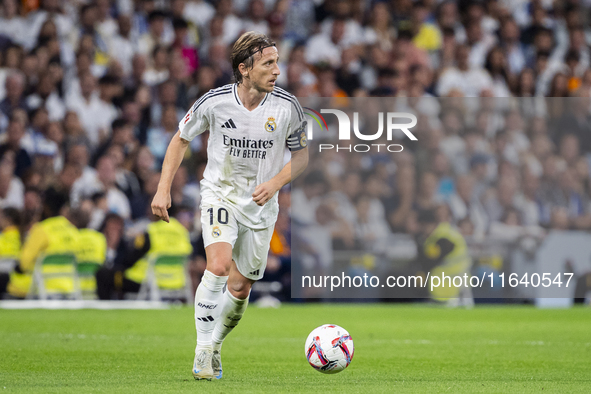 Luka Modric of Real Madrid CF is in action with the ball during the La Liga EA Sports 2024/25 football match between Real Madrid CF and Vill...