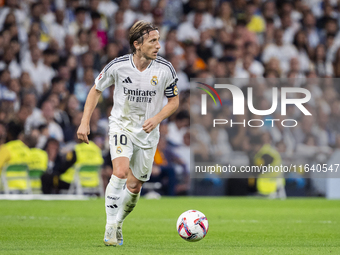 Luka Modric of Real Madrid CF is in action with the ball during the La Liga EA Sports 2024/25 football match between Real Madrid CF and Vill...