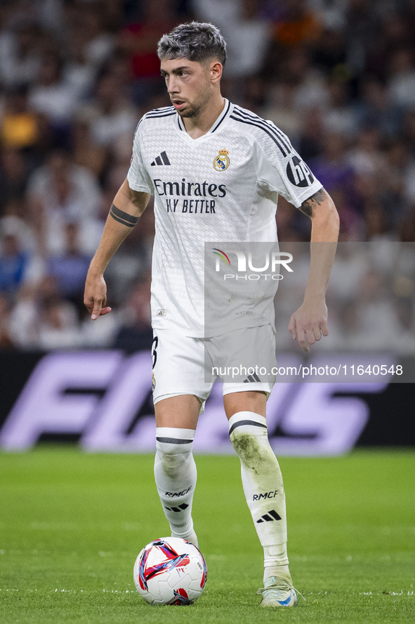 Federico Valverde of Real Madrid CF is in action with the ball during the La Liga EA Sports 2024/25 football match between Real Madrid CF an...