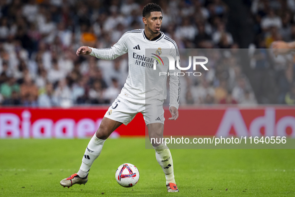 Jude Bellingham of Real Madrid CF is in action with the ball during the La Liga EA Sports 2024/25 football match between Real Madrid CF and...