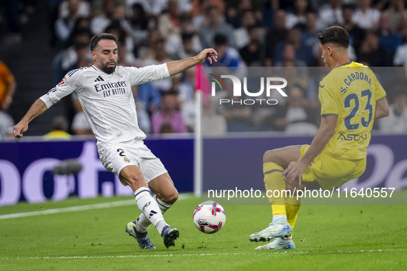 Daniel Carvajal of Real Madrid CF (L) competes for the ball against Sergi Cardona of Villarreal CF (R) during the La Liga EA Sports 2024/25...