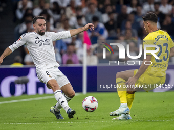 Daniel Carvajal of Real Madrid CF (L) competes for the ball against Sergi Cardona of Villarreal CF (R) during the La Liga EA Sports 2024/25...