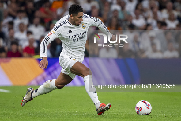 Jude Bellingham of Real Madrid CF is in action with the ball during the La Liga EA Sports 2024/25 football match between Real Madrid CF and...