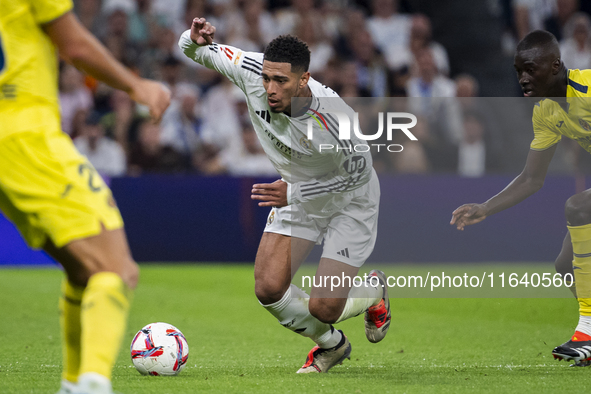 Jude Bellingham of Real Madrid CF is in action with the ball during the La Liga EA Sports 2024/25 football match between Real Madrid CF and...