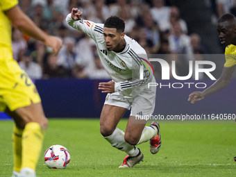 Jude Bellingham of Real Madrid CF is in action with the ball during the La Liga EA Sports 2024/25 football match between Real Madrid CF and...