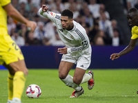 Jude Bellingham of Real Madrid CF is in action with the ball during the La Liga EA Sports 2024/25 football match between Real Madrid CF and...