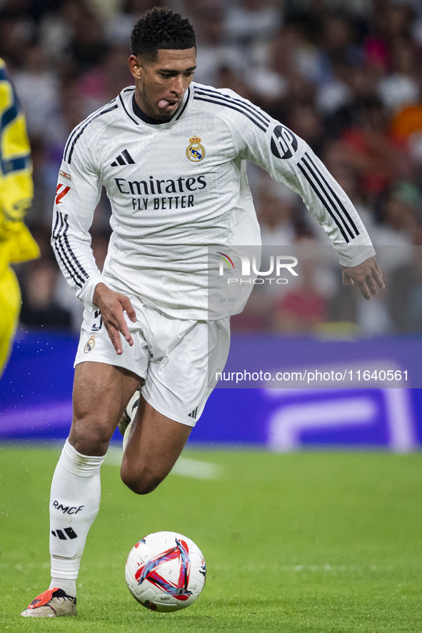 Jude Bellingham of Real Madrid CF is in action with the ball during the La Liga EA Sports 2024/25 football match between Real Madrid CF and...