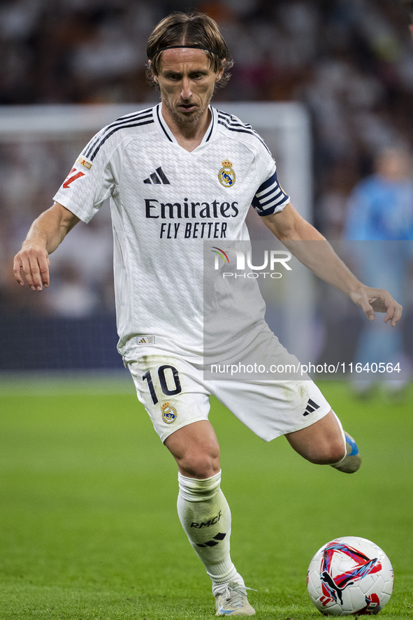 Luka Modric of Real Madrid CF is in action with the ball during the La Liga EA Sports 2024/25 football match between Real Madrid CF and Vill...