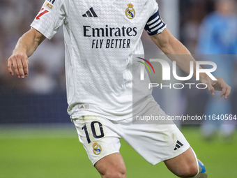 Luka Modric of Real Madrid CF is in action with the ball during the La Liga EA Sports 2024/25 football match between Real Madrid CF and Vill...