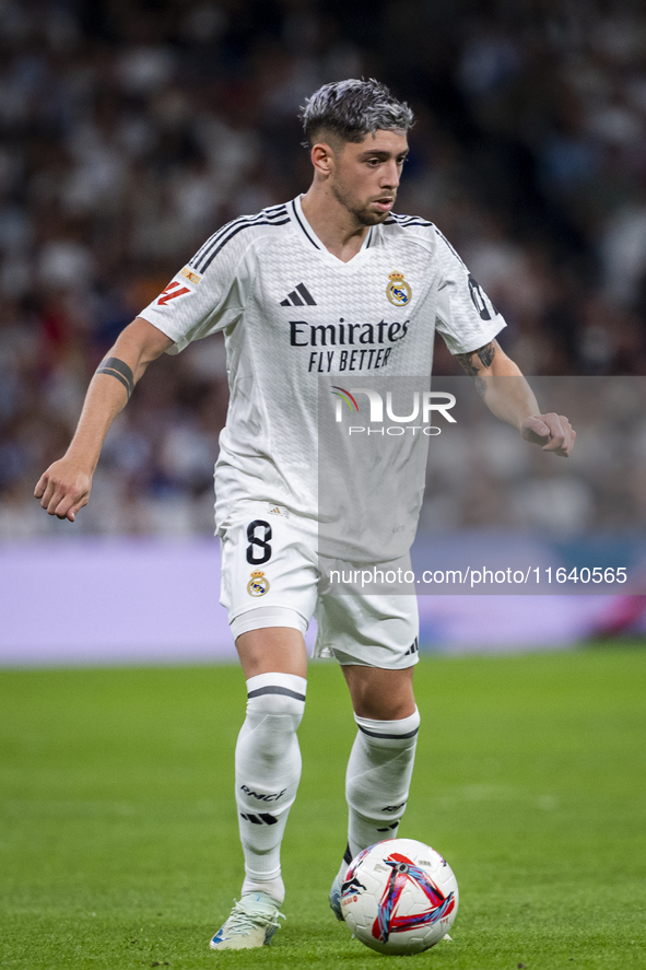 Federico Valverde of Real Madrid CF is in action with the ball during the La Liga EA Sports 2024/25 football match between Real Madrid CF an...