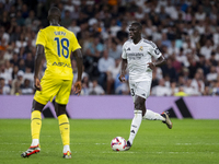 Ferland Mendy of Real Madrid CF (R) is in action with the ball against Pape Gueye of Villarreal CF (L) during the La Liga EA Sports 2024/25...