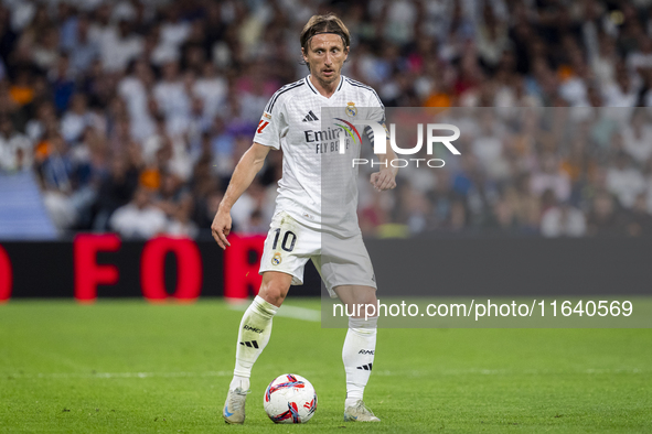 Luka Modric of Real Madrid CF is in action with the ball during the La Liga EA Sports 2024/25 football match between Real Madrid CF and Vill...