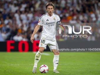 Luka Modric of Real Madrid CF is in action with the ball during the La Liga EA Sports 2024/25 football match between Real Madrid CF and Vill...