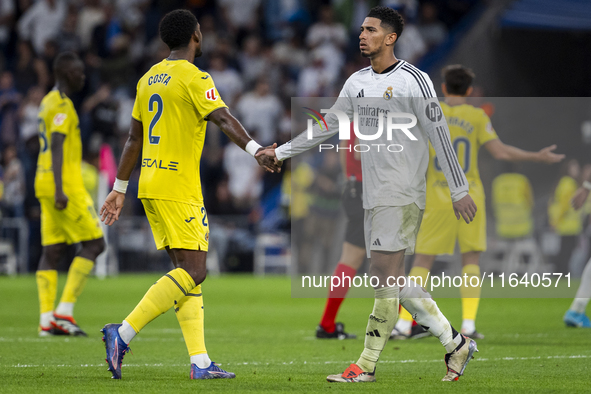 Jude Bellingham of Real Madrid CF (R) cheers Logan Costa of Villarreal CF (L) at the end of the La Liga EA Sports 2024/25 football match bet...