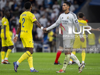 Jude Bellingham of Real Madrid CF (R) cheers Logan Costa of Villarreal CF (L) at the end of the La Liga EA Sports 2024/25 football match bet...