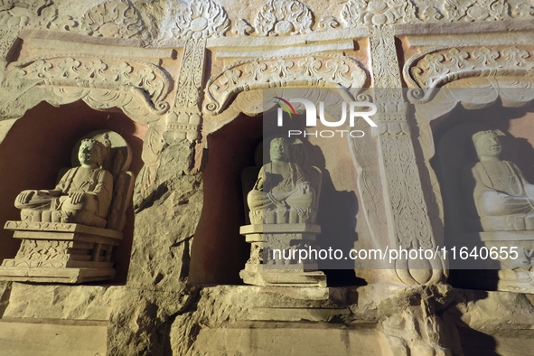 Lifelike statues are seen in the Xiangtang Mountain Grottoes in Handan, China, on October 5, 2024. 