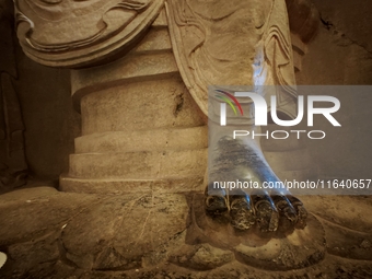 Lifelike statues are seen in the Xiangtang Mountain Grottoes in Handan, China, on October 5, 2024. (