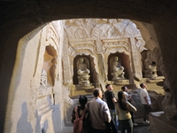 Tourists visit the Xiangtang Mountain Grottoes in Handan, China, on October 5, 2024. (