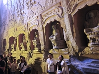 Tourists visit the Xiangtang Mountain Grottoes in Handan, China, on October 5, 2024. (