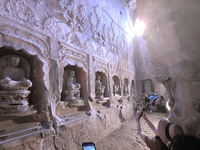 Tourists visit the Xiangtang Mountain Grottoes in Handan, China, on October 5, 2024. (