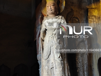 Tourists visit the Xiangtang Mountain Grottoes in Handan, China, on October 5, 2024. (