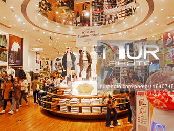 Transformers x UNIQLO co-branded custom T-shirts are displayed at the Uniqlo flagship store in Shanghai, China, on October 4, 2024. This yea...