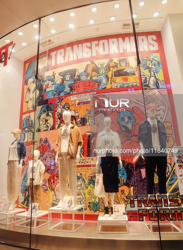 Transformers x UNIQLO co-branded custom T-shirts are displayed at the Uniqlo flagship store in Shanghai, China, on October 4, 2024. This yea...