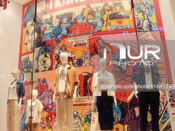 Transformers x UNIQLO co-branded custom T-shirts are displayed at the Uniqlo flagship store in Shanghai, China, on October 4, 2024. This yea...