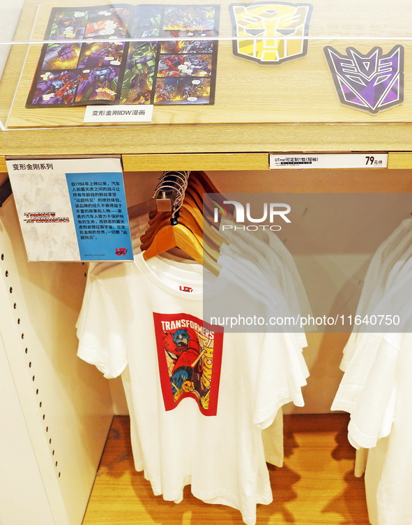 Transformers x UNIQLO co-branded custom T-shirts are displayed at the Uniqlo flagship store in Shanghai, China, on October 4, 2024. This yea...