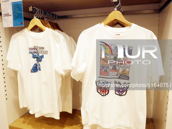 Transformers x UNIQLO co-branded custom T-shirts are displayed at the Uniqlo flagship store in Shanghai, China, on October 4, 2024. This yea...