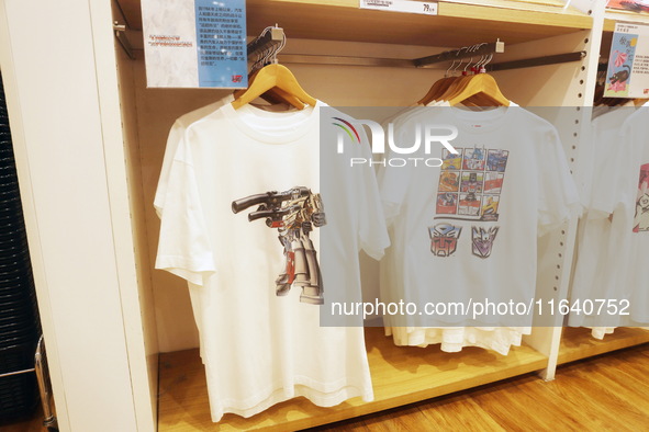 Transformers x UNIQLO co-branded custom T-shirts are displayed at the Uniqlo flagship store in Shanghai, China, on October 4, 2024. This yea...